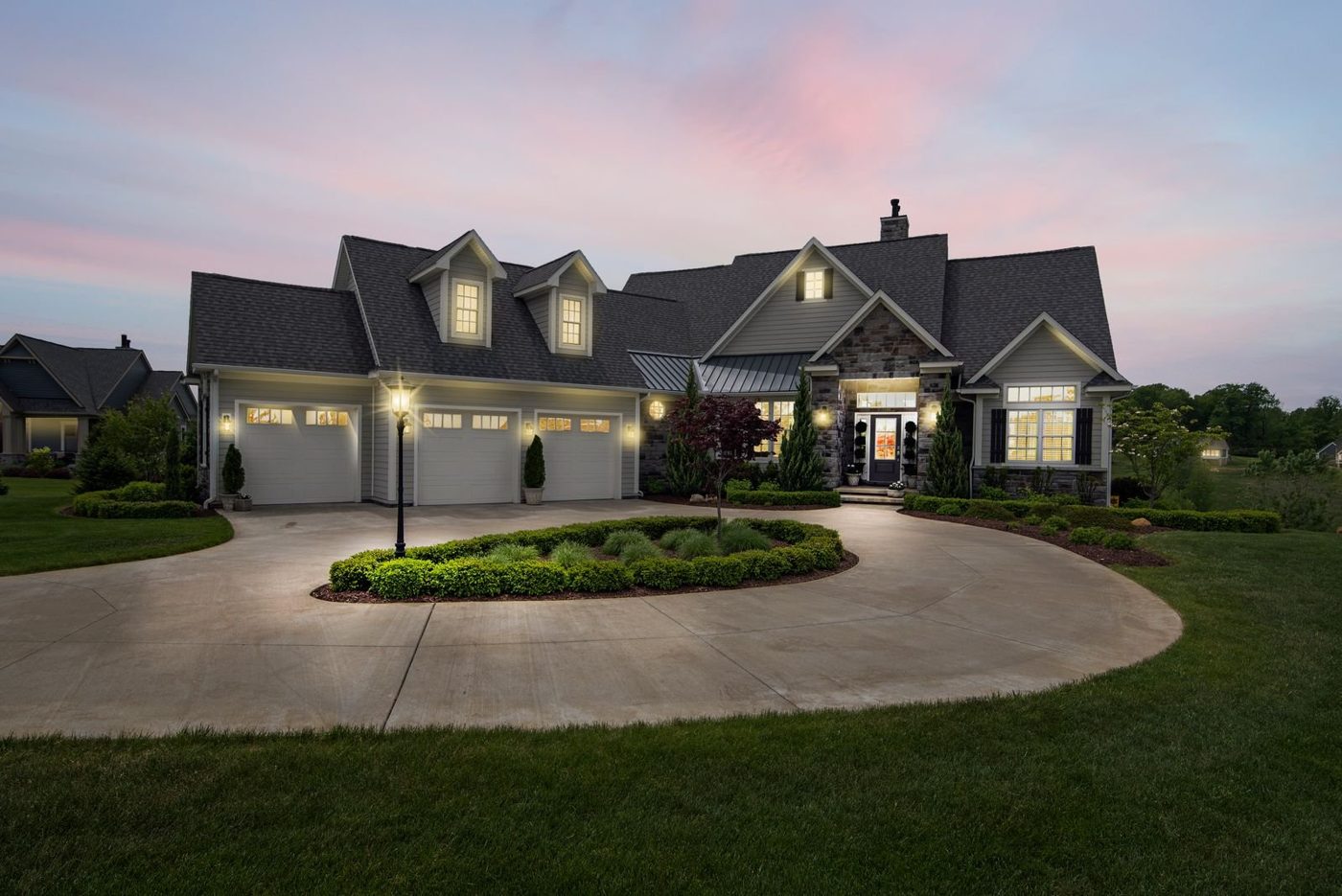 Example of a home with landscape lighting at dusk